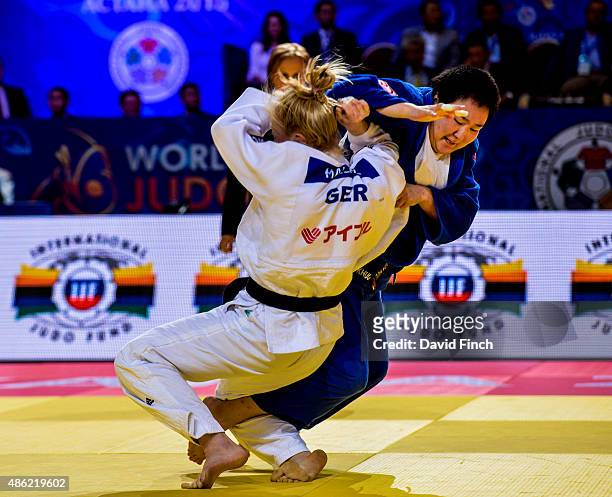 Luise Malzahn of Germany is caught for a small score by Javzmaa Odkhuu of Mongolia but eventually won the contest ippon enabling Germany to win the...