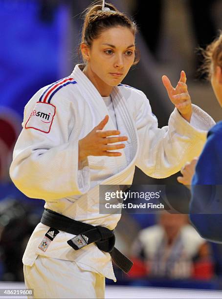 Automne Pavia of the French team defeated Tatiana Kazenyuk of Russia by an ippon with a hold during the 2015 Astana World Judo Team Championships at...