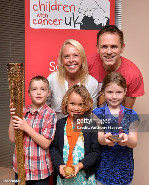 Jayne Torvill and Chris Jarvis with children who have suffered from cancer during a photocall ahead of a Golden Tea in aid of Childhood Cancer...