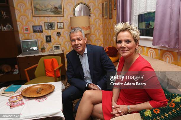 German Journalist Peter Kloepel and German Singer and Actress Inka Bause participate in a photo call in a reconstruction of a typical East German...