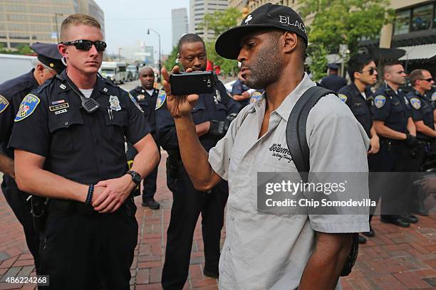 Baltimore City police form a line to hold protesters back during a demonstration at the Inner Harbor September 2, 2015 in Baltimore, Maryland. Rose...