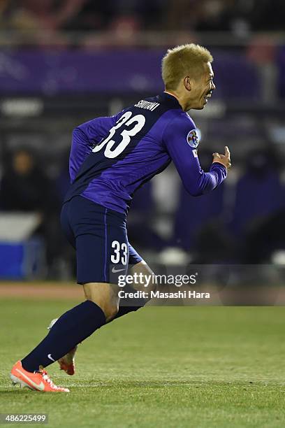 Tsukasa Shiotani of Sanfrecce Hiroshima celebrates after his assist of the first goal during the AFC Champions League Group F match between Sanfrecce...