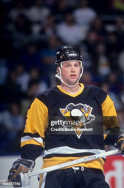 Scott Young of the Pittsburgh Penguins skates on the ice during an NHL preseason game against the New York Islanders in September 1990 at the Nassau...