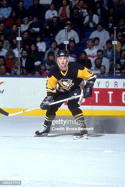 Scott Young of the Pittsburgh Penguins skates on the ice during an NHL preseason game against the New York Islanders in September 1990 at the Nassau...