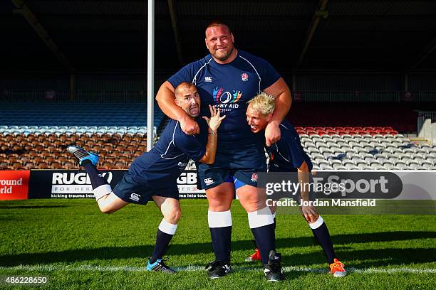 Former England's Strongest Man Terry Hollands poses for a photo with dancer Louie Spence and Made In Chelsea actor Jamie Laing during the Rugby Aid...