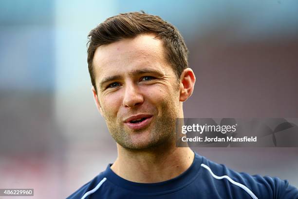 Harry Judd looks on during the Rugby Aid 2015 celebrity rugby match media session at Twickenham Stoop on September 2, 2015 in London, England.