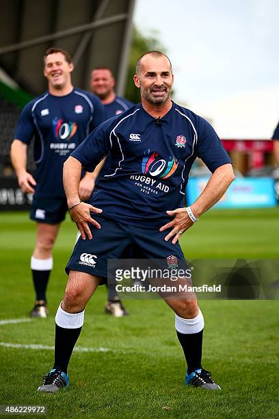 Dancer Louie Spence leads a warm-up during the Rugby Aid 2015 celebrity rugby match media session at Twickenham Stoop on September 2, 2015 in London,...
