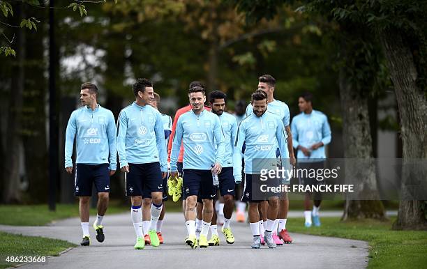 French players arrives for a training session in Clairefontaine-en-Yvelines on September 2 two days ahead of the team friendly football match against...