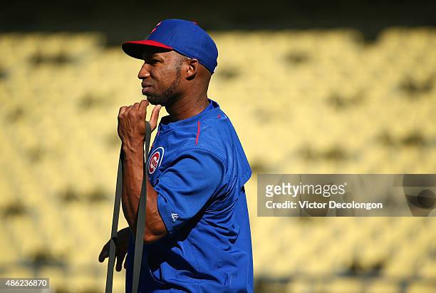 Jonathan Herrera of the Chicago Cubs stretches before taking batting practice prior to their MLB game against the Los Angeles Dodgers at Dodger...