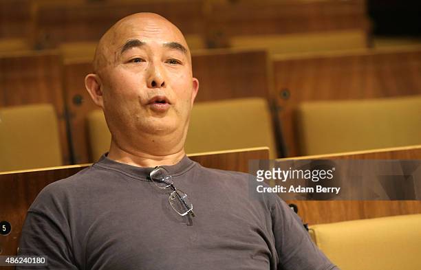 Chinese poet Liao Yiwu waits for the beginning of a panel discussion at the Berlin International Literature Festival on September 2, 2015 in Berlin,...