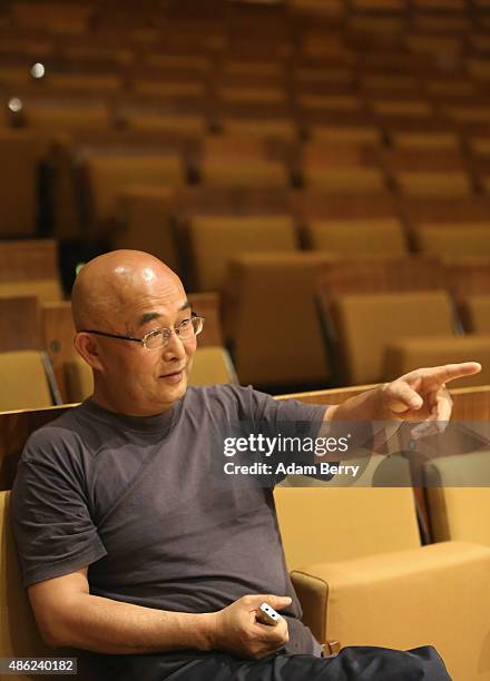 Chinese poet Liao Yiwu waits for the beginning of a panel discussion at the Berlin International Literature Festival on September 2, 2015 in Berlin,...