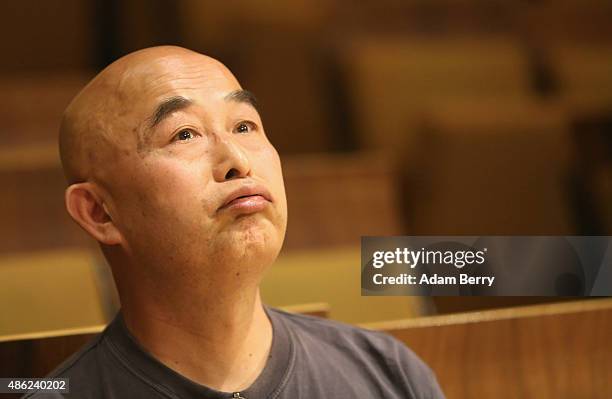 Chinese poet Liao Yiwu waits for the beginning of a panel discussion at the Berlin International Literature Festival on September 2, 2015 in Berlin,...