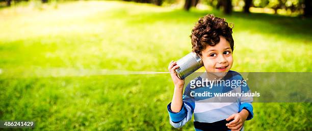 child communication concept - listening tin can stock pictures, royalty-free photos & images