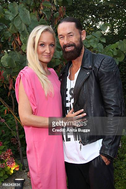Janine Kunze and her husband Dirk Budach attend the JT Tourism BBQ Party at 'Pink Villa' on September 2, 2015 in Berlin, Germany.