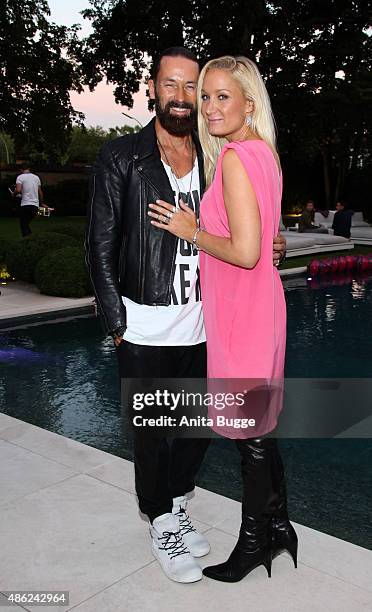 Janine Kunze and her husband Dirk Budach attend the JT Tourism BBQ Party at 'Pink Villa' on September 2, 2015 in Berlin, Germany.