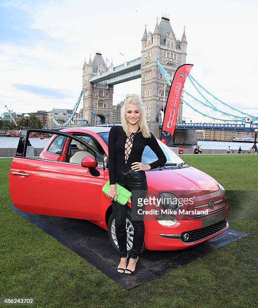 Pixie Lott attends the New Remastered Fiat 500 launch with an exclusive performance by Ella Eyre at Potters Field Park on September 2, 2015 in...