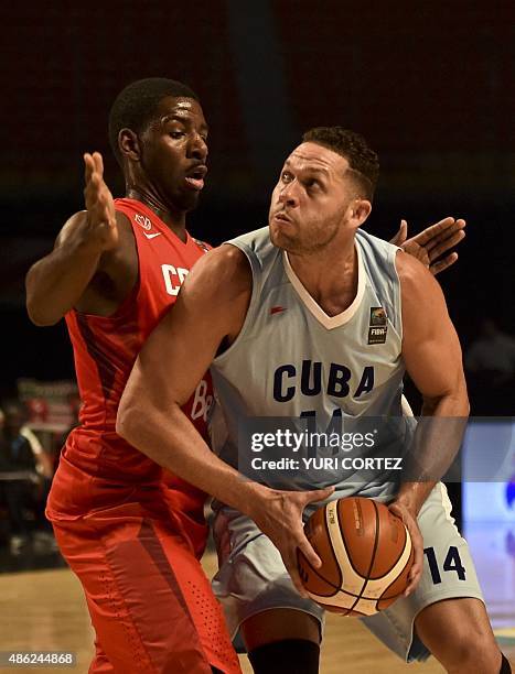 Canada's power forward Andrew Nicholson blocks Cuba's power forward Orestes Torres during a 2015 FIBA Americas Championship Men's Olympic qualifying...