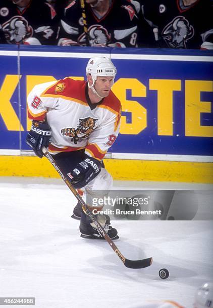 Kirk Muller of the Florida Panthers skates with the puck during an NHL game against the Buffalo Sabres on March 22, 1997 at the Miami Arena in Miami,...