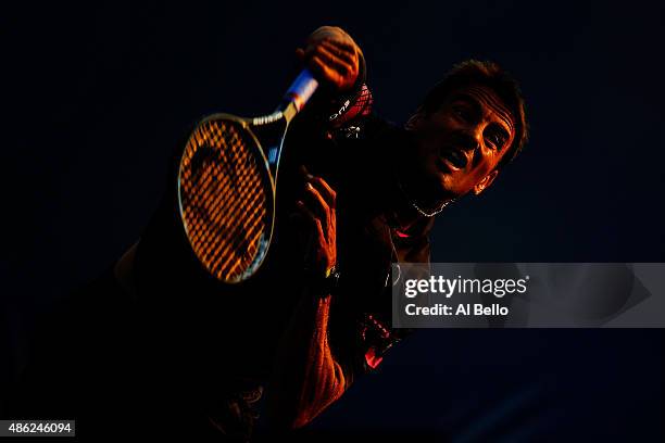 Tommy Robredo of Spain serves against Sam Groth of Australia during their Men's Singles Second Round match against on Day Three of the 2015 US Open...