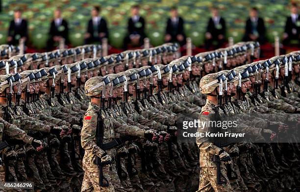 Chinese soldiers march past Tiananmen Square before a military parade on September 3, 2015 in Beijing, China. China is marking the 70th anniversary...