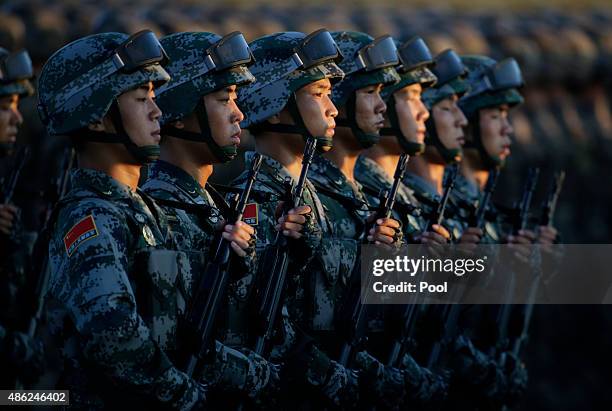 Soldiers of China's People Liberation Army prepare in front of the Tiananmen Gate ahead of the military parade to mark the 70th Anniversary of the...