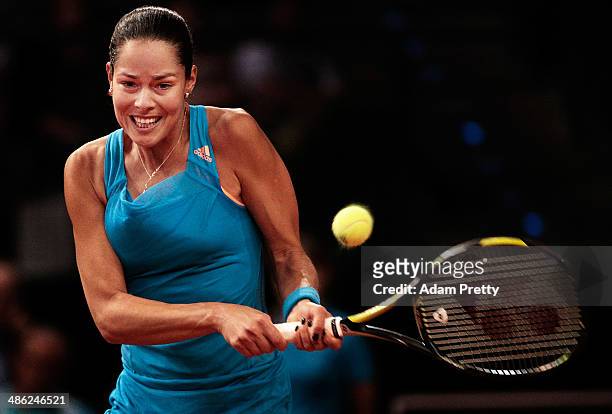 Anna Ivanovic of Serbia hits a backhand during her match against Sabine Lisicki of Germany during day 3 of the Porsche Tennis Grand Prix 2014 at...