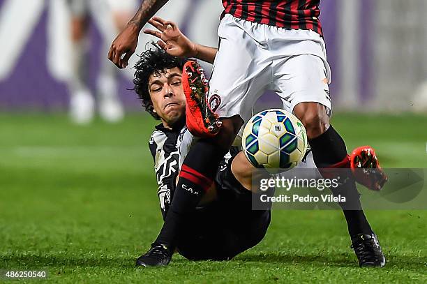 Luan of Atletico MG and Ewandro of Atletico PR battle for the ball during a match between Atletico MG and Atletico PR as part of Brasileirao Series A...