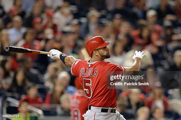 Albert Pujols of the Los Angeles Angels of Anaheim hits a two-run home run against the Washington Nationals in the fifth inning at Nationals Park on...