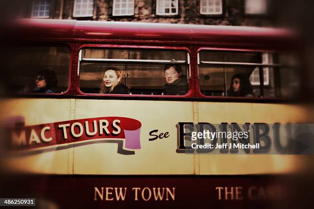 Waman smiles as she looks from a tourist bus on the Royal Mile on April 23, 2014 in Edinburgh, Scotland. A referendum on whether Scotland should be...