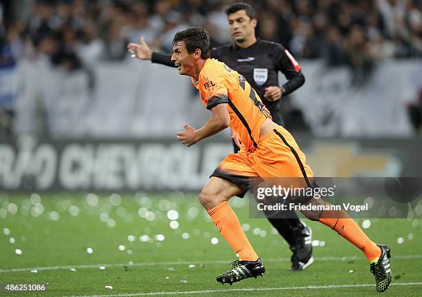 Marciel of Corinthians celebrates scoring the first goal during the match between Corinthians and Fluminense for the Brazilian Series A 2015 at Arena...