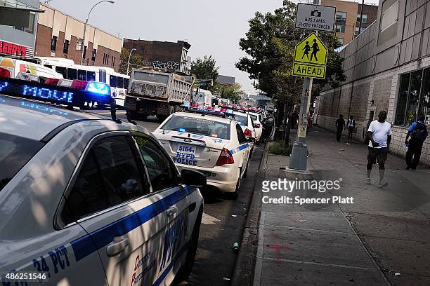 Police car patrols an area which has witnessed an explosion in the use of K2 or 'Spice', a synthetic marijuana drug, in East Harlem on September 02,...