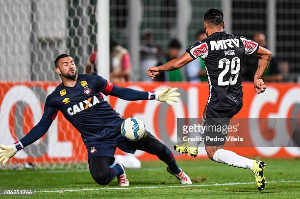 Patric of Atletico MG and Weverton of Atletico PR battle for the ball during a match between Atletico MG and Atletico PR as part of Brasileirao...