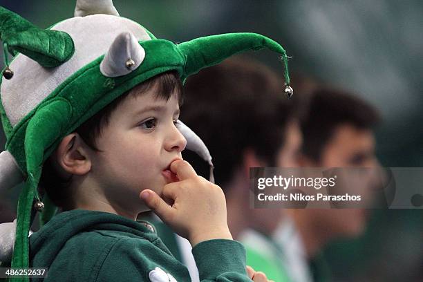 Young fan watches the game during the Turkish Airlines Euroleague Basketball Play Off Game 4 between Panathinaikos Athens v CSKA Moscow at Olimpic...