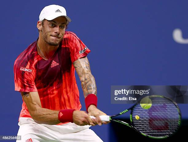 Andreas Haider-Maurer of Austria returns a shot to Novak Djokovic of Serbia on Day Three of the 2015 US Open at the USTA Billie Jean King National...