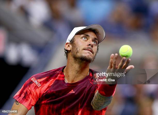 Andreas Haider-Maurer of Austria serves the ball to Novak Djokovic of Serbia on Day Three of the 2015 US Open at the USTA Billie Jean King National...