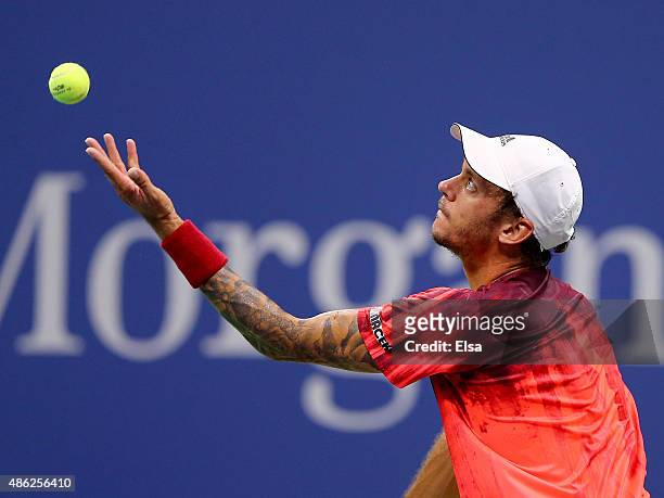 Andreas Haider-Maurer of Austria serves the ball to Novak Djokovic of Serbia on Day Three of the 2015 US Open at the USTA Billie Jean King National...