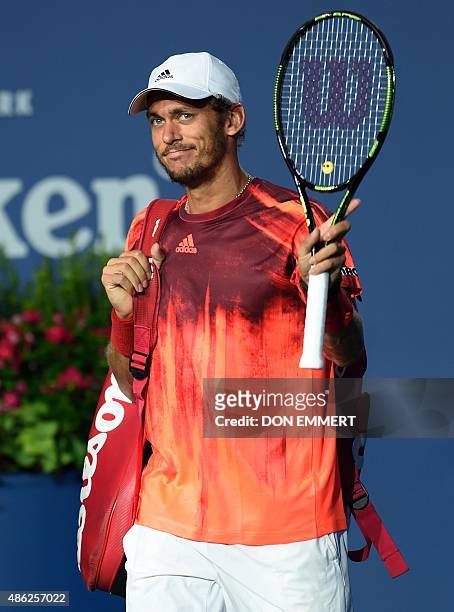 Andreas Haider-Maurer of Austria walks onto the court before playing Novak Djokovic of Serbia during their US Open 2015 second round men's singles...