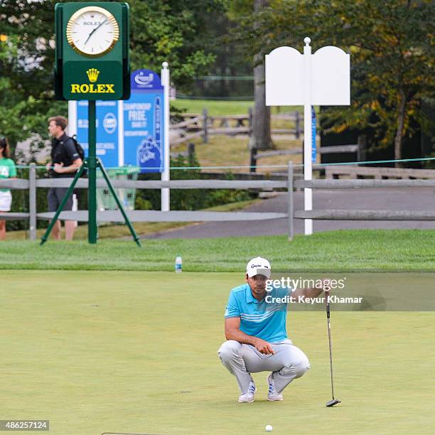 Jason Day of Australia reads a putt during practice for the Deutsche Bank Championship at TPC Boston on September 2, 2015 in Norton, Massachusetts.