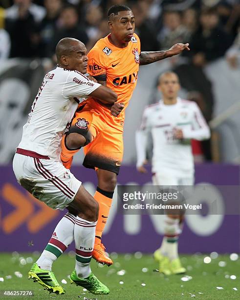 Malcom of Corinthians fights for the ball with Henrique of Fluminense during the match between Corinthians and Fluminense for the Brazilian Series A...