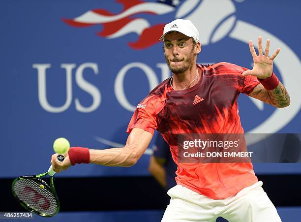 Andreas Haider-Maurer of Austria hits a return to Novak Djokovic of Serbia during their US Open 2015 second round men's singles match at the USTA...