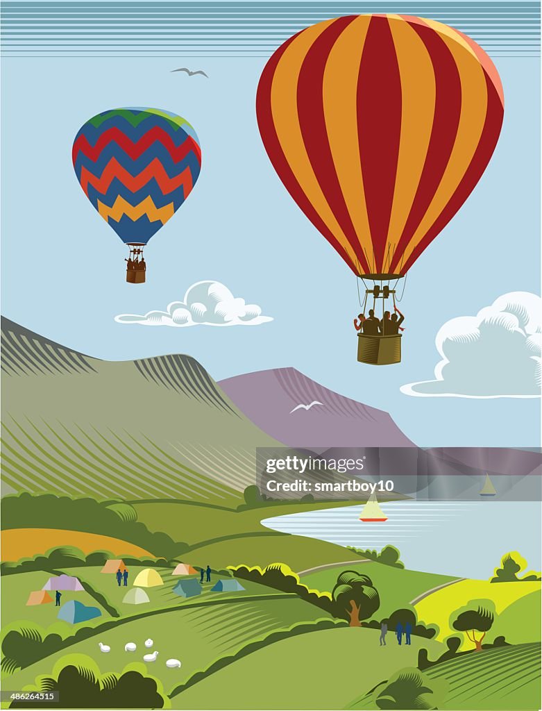 Hot air balloons over countryside