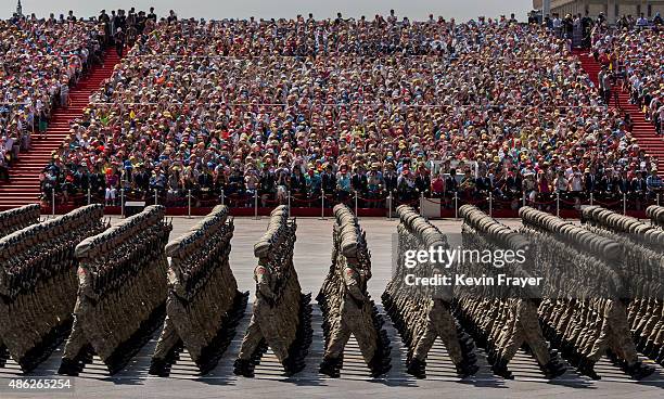 Chinese march in formation past Tiananmen Square and the Forbidden City during a military parade on September 3, 2015 in Beijing, China. China is...