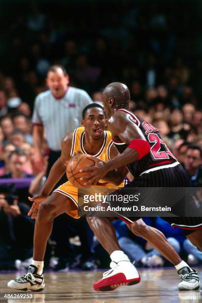 Michael Jordan of the Chicago Bulls drives against Kobe Bryant of the Los Angeles Lakers on February 5, 1997 at the Great Western Forum in Inglewood,...