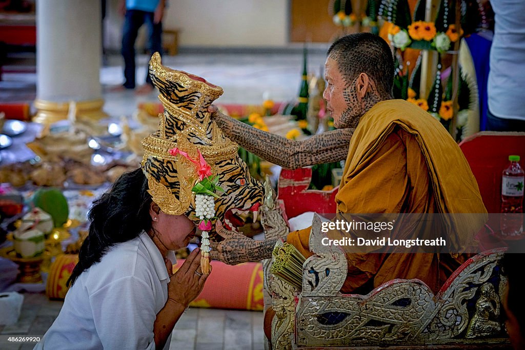 Thai devotees to the ancient ritual of Sak Yant gather with...