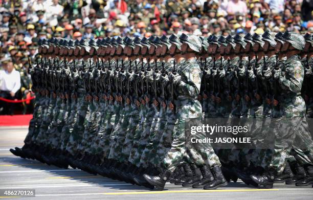 China's People's Liberation Army soldiers march past Tiananmen Gate during a military parade in Beijing on September 3 to mark the 70th anniversary...