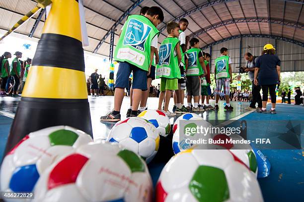 Kids practice exercises during visit a FIFA 11 for Health Program as part of the 2014 FIFA World Cup Host City Tour on April 23, 2014 in Cuiaba,...