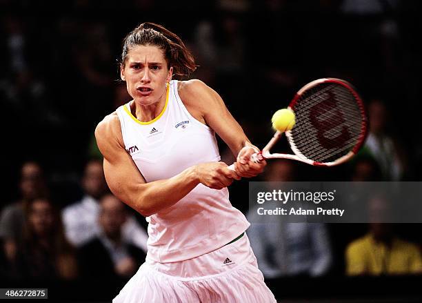 Andrea Petkovic of Germany hits a backhand during her match against Flavia Pennetta of Italy during day 3 of the Porsche Tennis Grand Prix 2014 at...