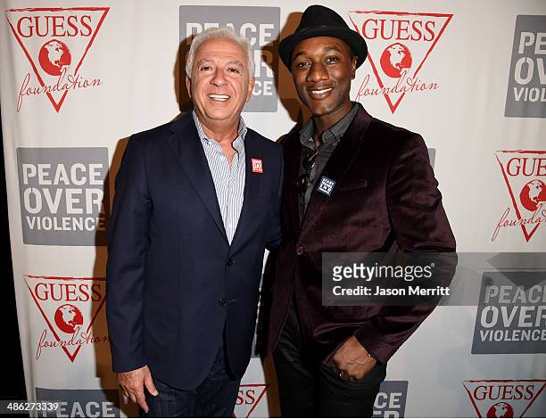 Co-founder of Guess? Inc. Paul Marciano and recording artist Aloe Blacc attend the GUESS and Peace Over Violence celebration of the 15th anniversary...