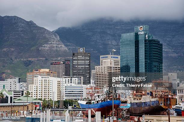 Skyscrapers and a shipyard lay at the bottom of Table Mountain in downtown Cape Town.