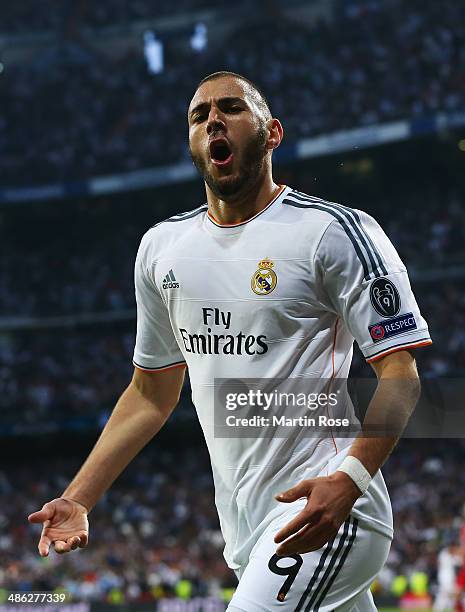 Karim Benzema of Real Madrid celebrates scoring the opening goal during the UEFA Champions League semi-final first leg match between Real Madrid and...